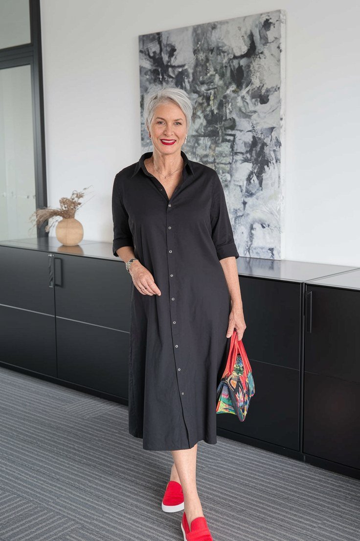 Black button-front shirt dress with sneakers for women over 50
