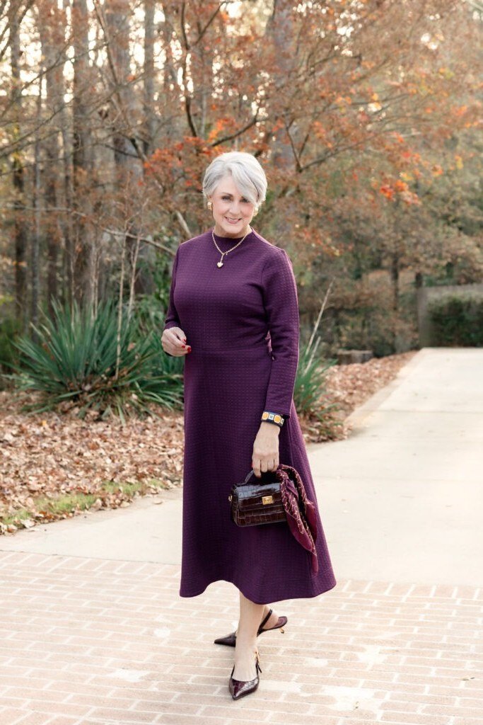 purple long sleeve midi dress burgundy bag women over 50