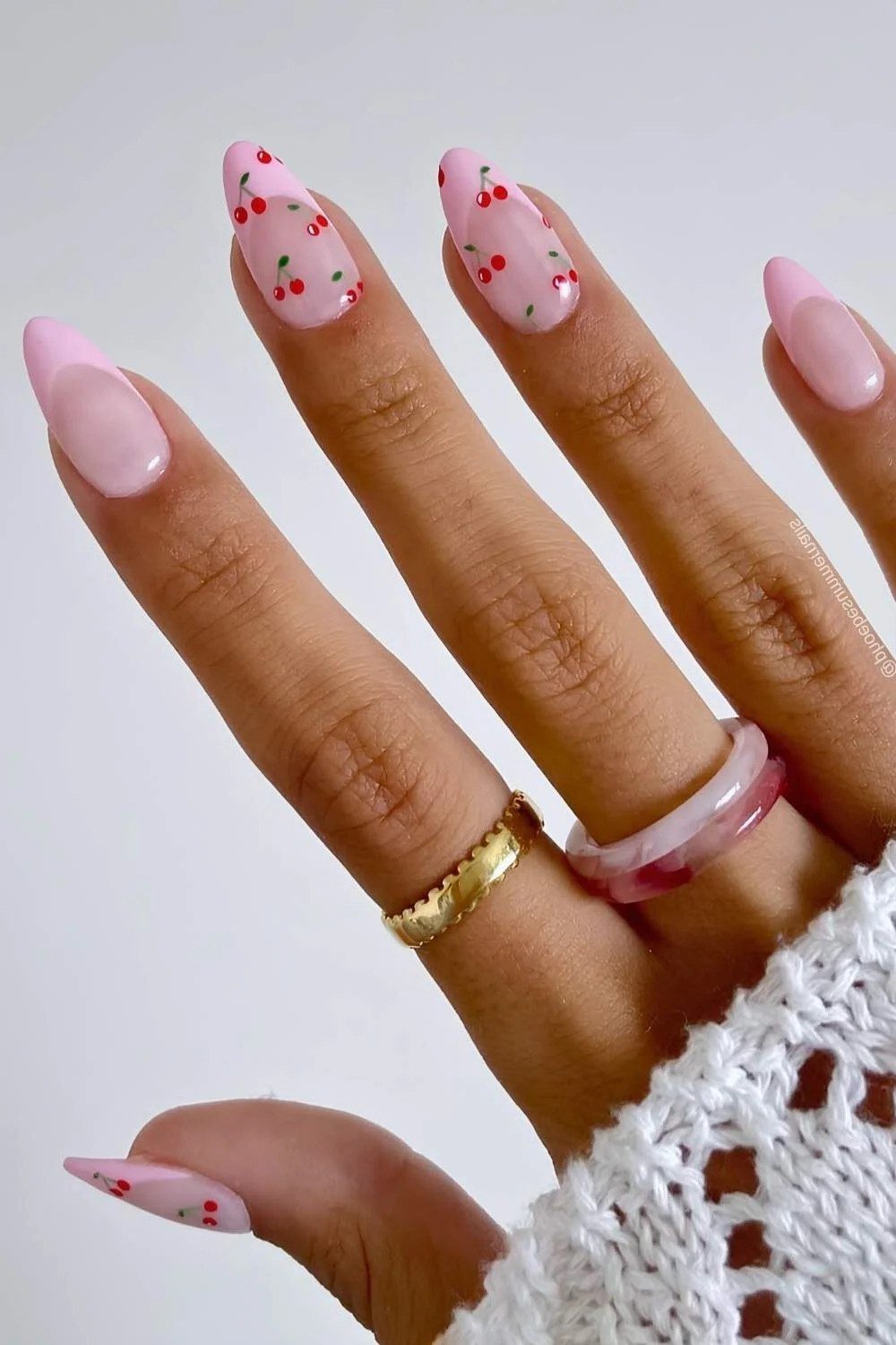 pink almond nails with tiny pink dot print
