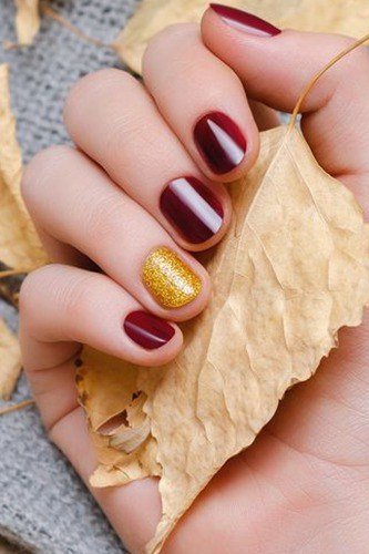 Burgundy with gold leaf on dried leaf, burgundy fall nail idea for women over 60