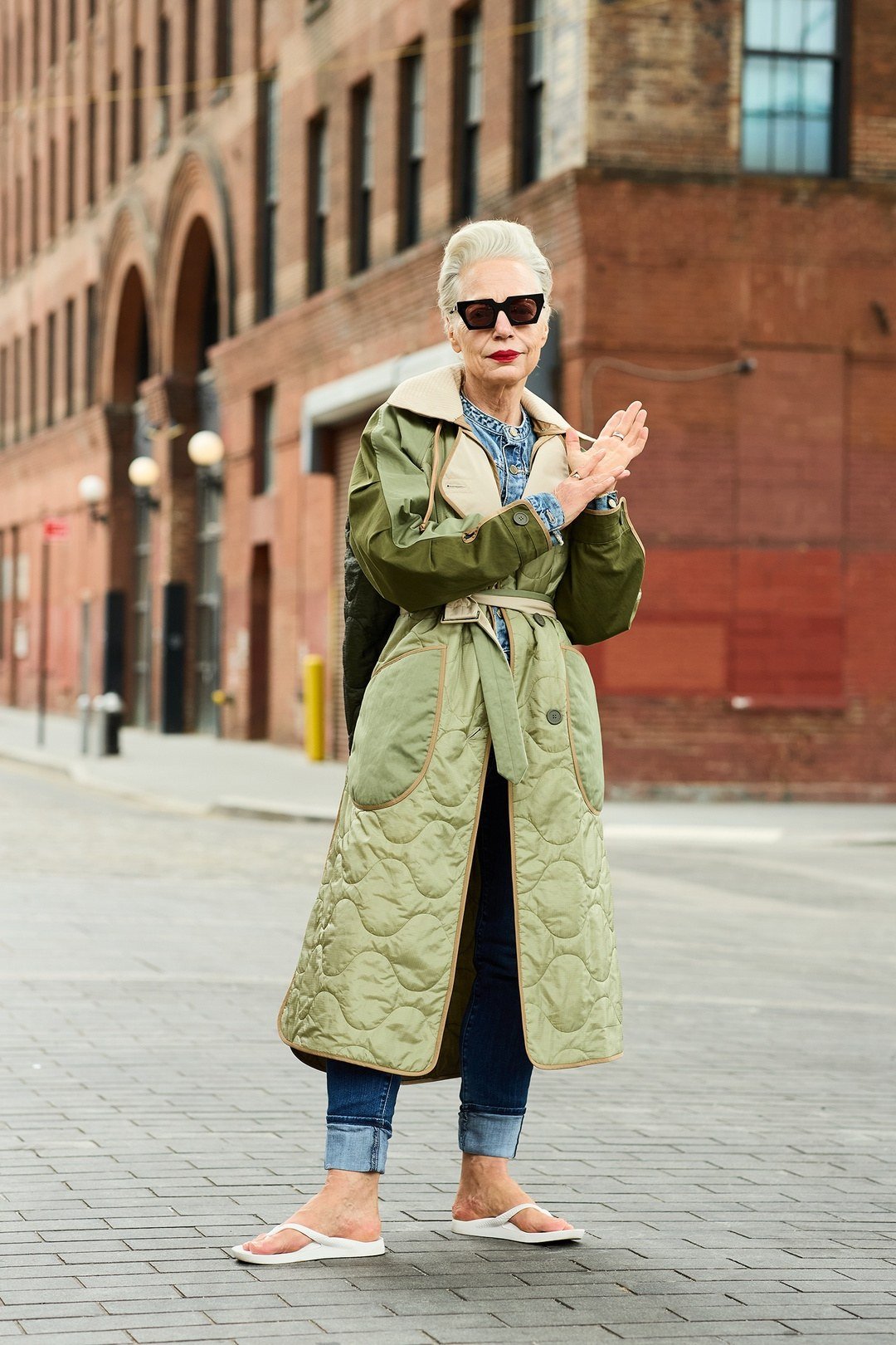 Green quilted coat with sunglasses outfit for women over 60