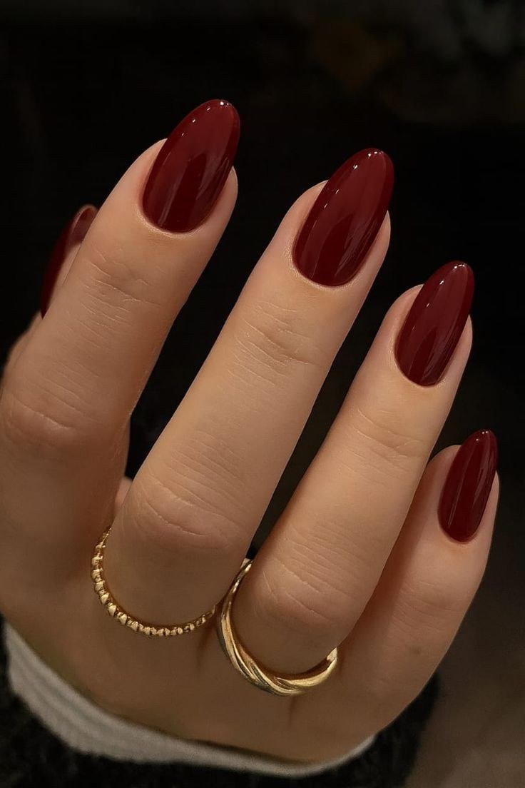 Deep Burgundy Almond Nails with Gold Rings, understated glam nail color for women over 60