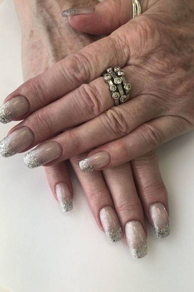 Nude nails with silver glitter fade tips