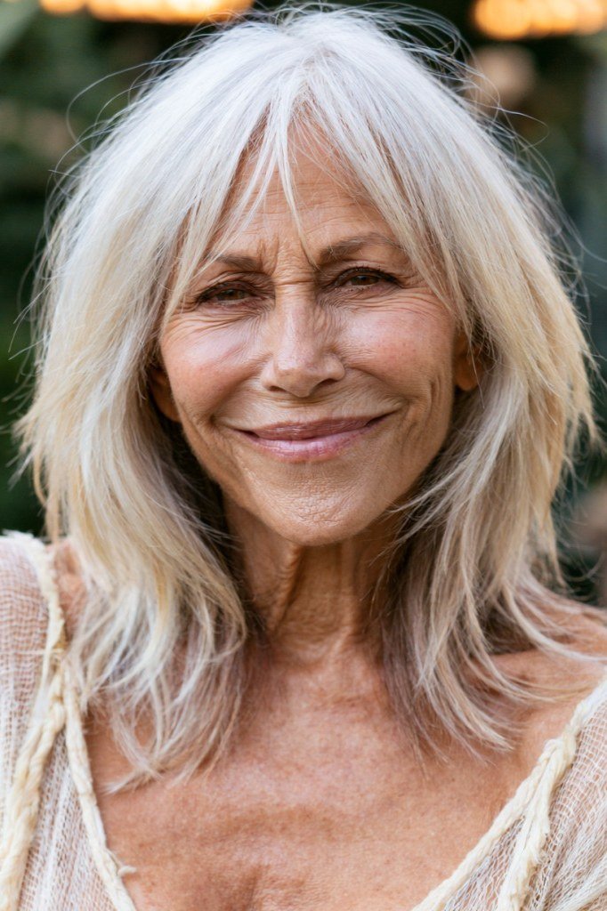 long silver waves with wispy bangs, front view hairstyle for women over 70