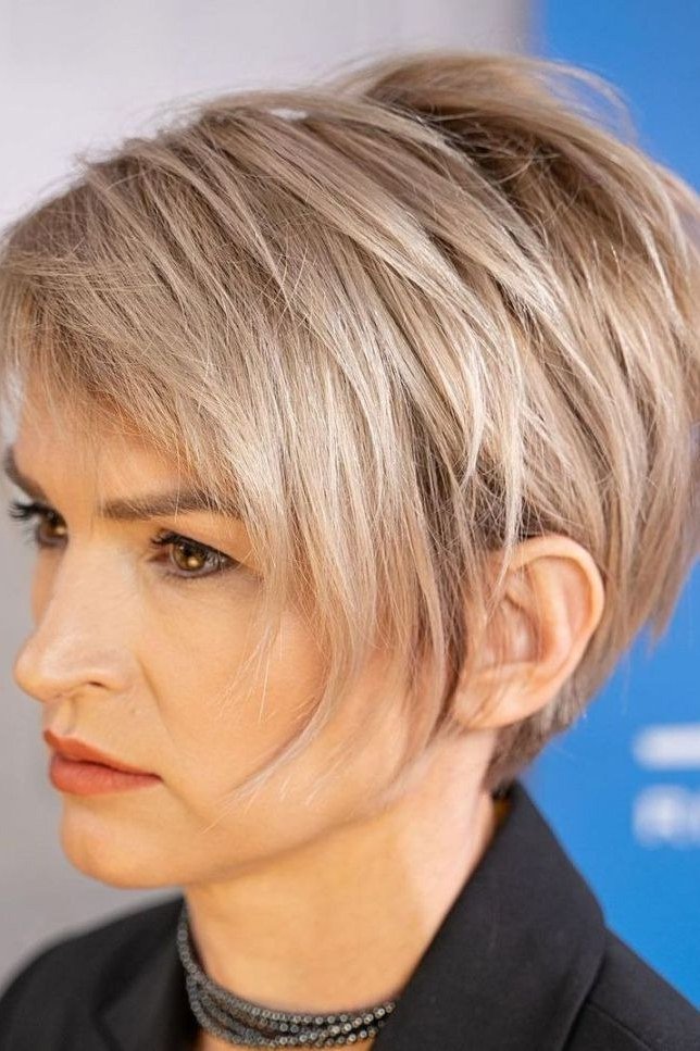 Ash blonde pixie, side view - wispy hairstyle for women over 40