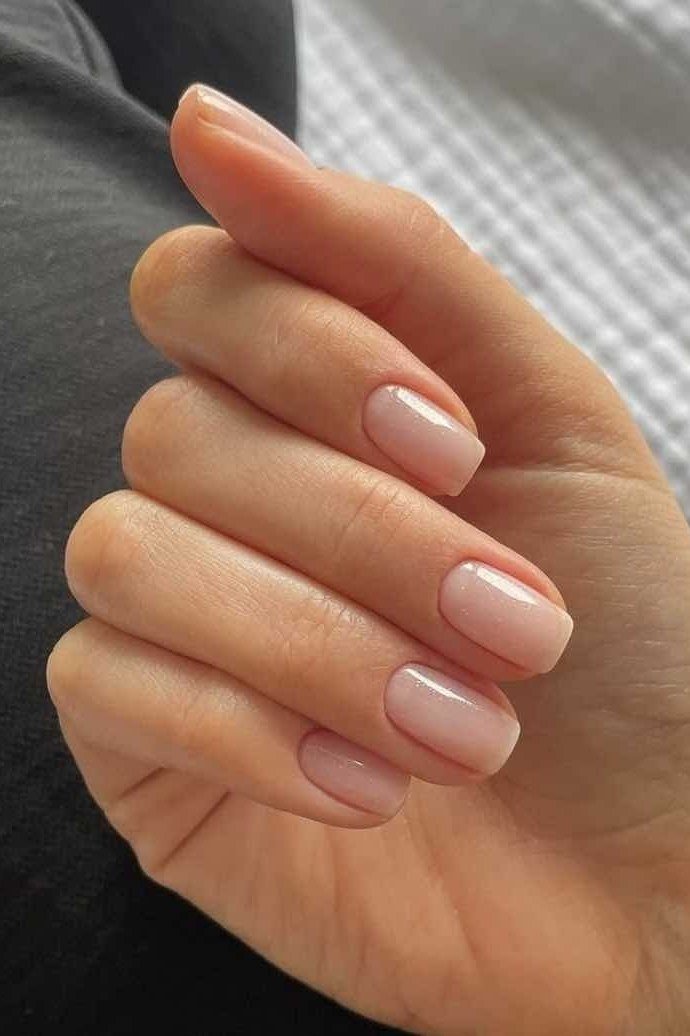 Warm Nude Beige Medium Oval Dark Background - elegant nude nail design for women over 60