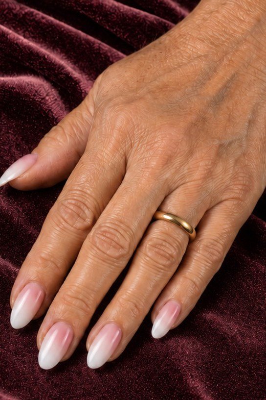 pink white baby boomer fade on long almond nails mature hand
