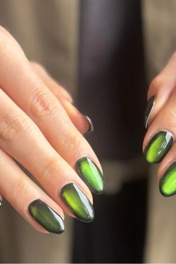 Moss Green Cat Eye Nails - Deep moss green with soft magnetic shimmer covers these medium length almond nails.