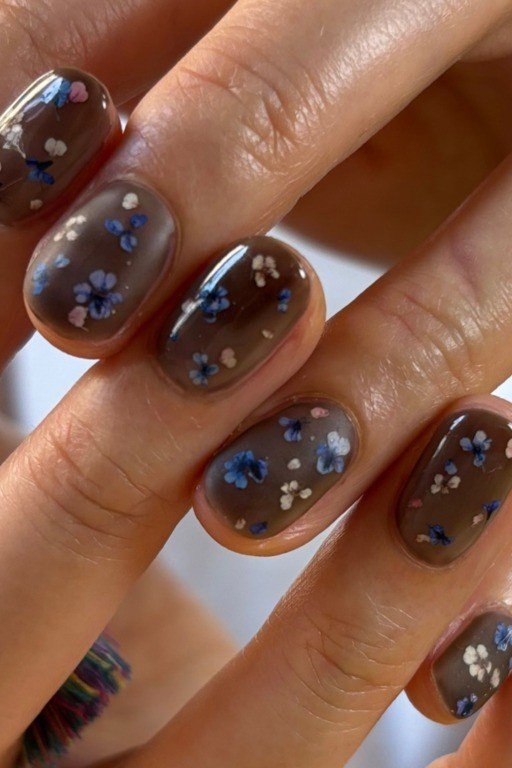 dark taupe nails with blue floral nail art