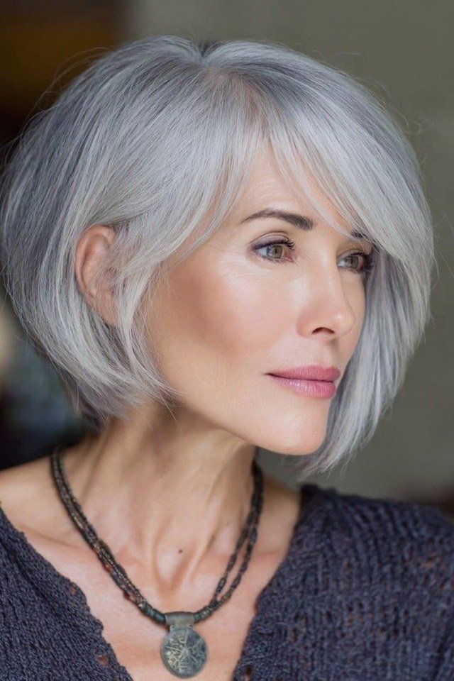 Layered Silver Shoulder Cut - grey shoulder length hairstyle for women over 60