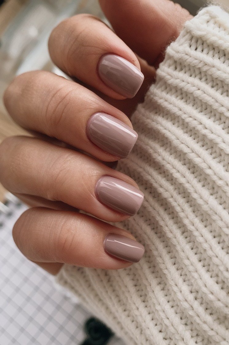 Mauve taupe nails with cream sweater, sophisticated nail design for women over 50