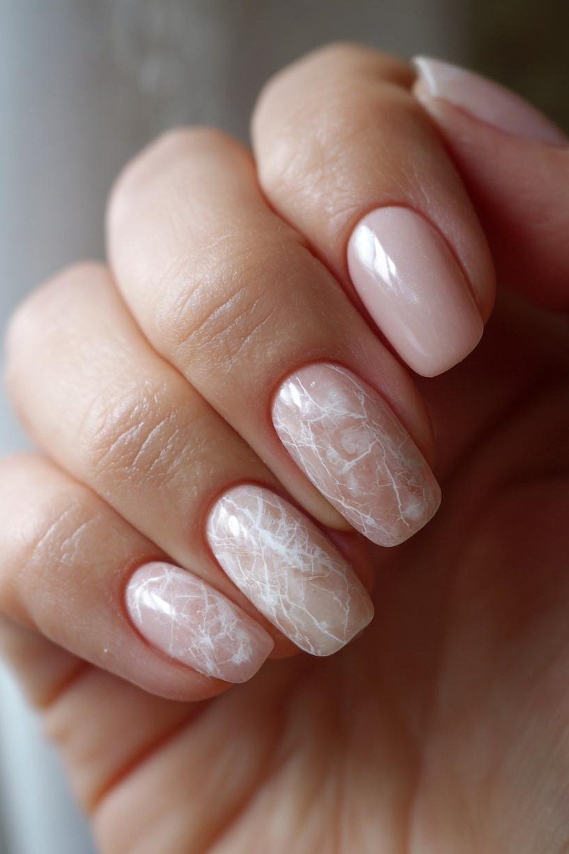 Pink Nude with White Marble Accents - short nude nail idea for women over 50