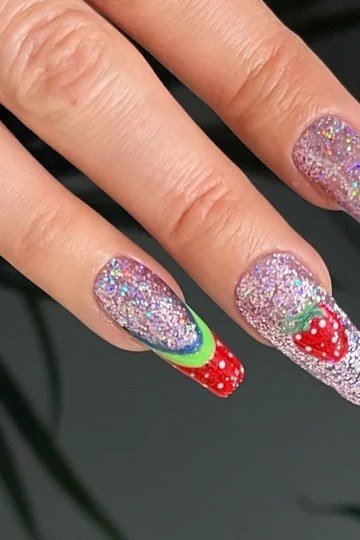Stiletto glitter nails with strawberry fruit art