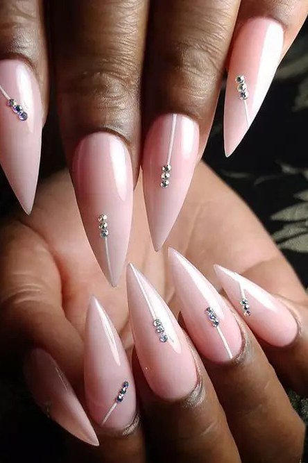 pink stiletto nails with rhinestone line accents