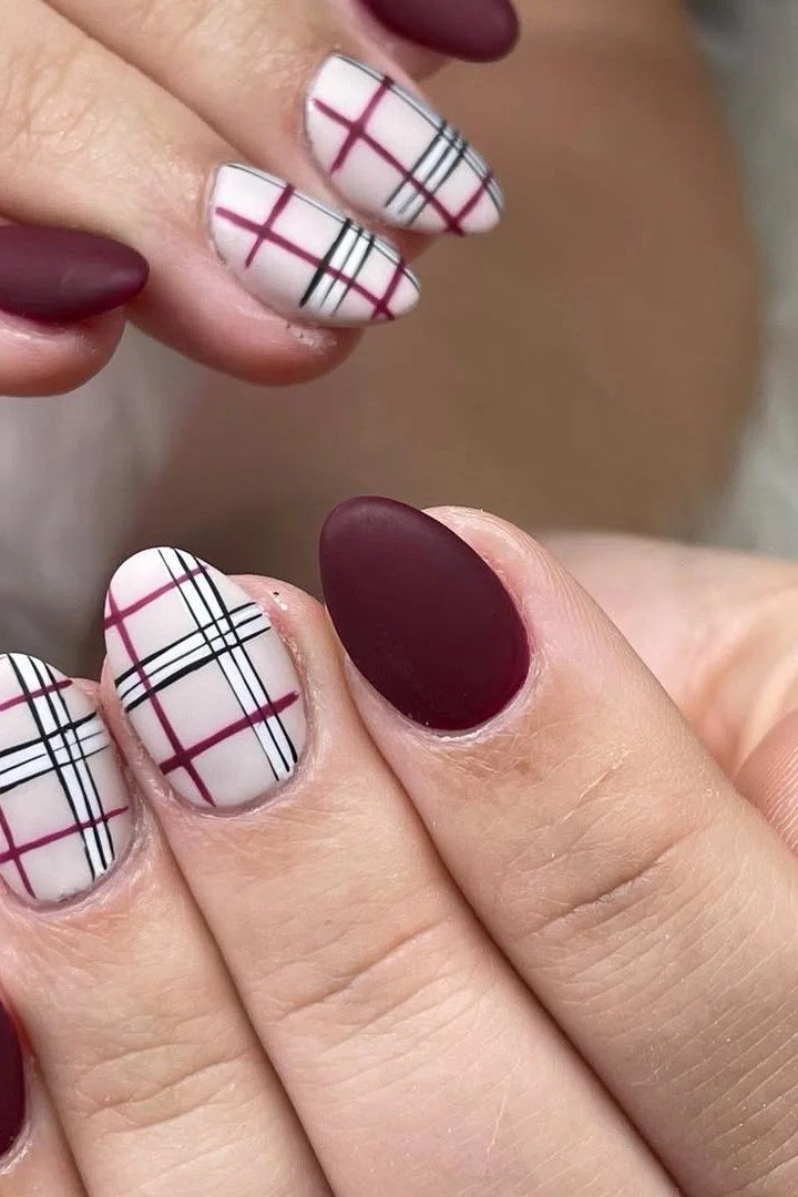 Matte burgundy with white plaid accent, burgundy fall nail idea for women over 60