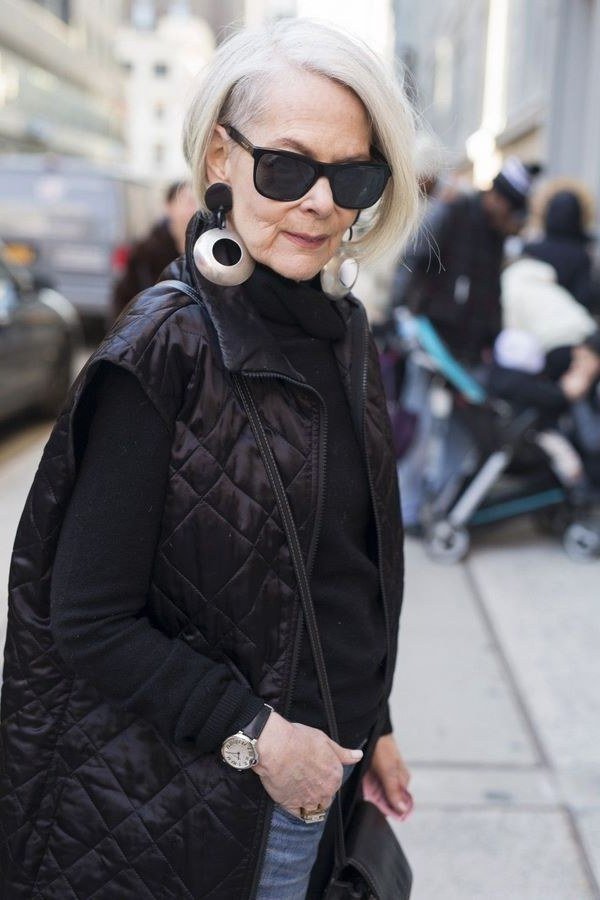 Black quilted vest with sunglasses outfit for women over 60