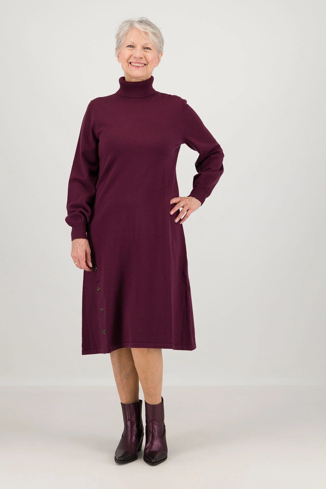 Burgundy turtleneck sweater dress with burgundy ankle boots, cozy sweater outfit idea for women over 70