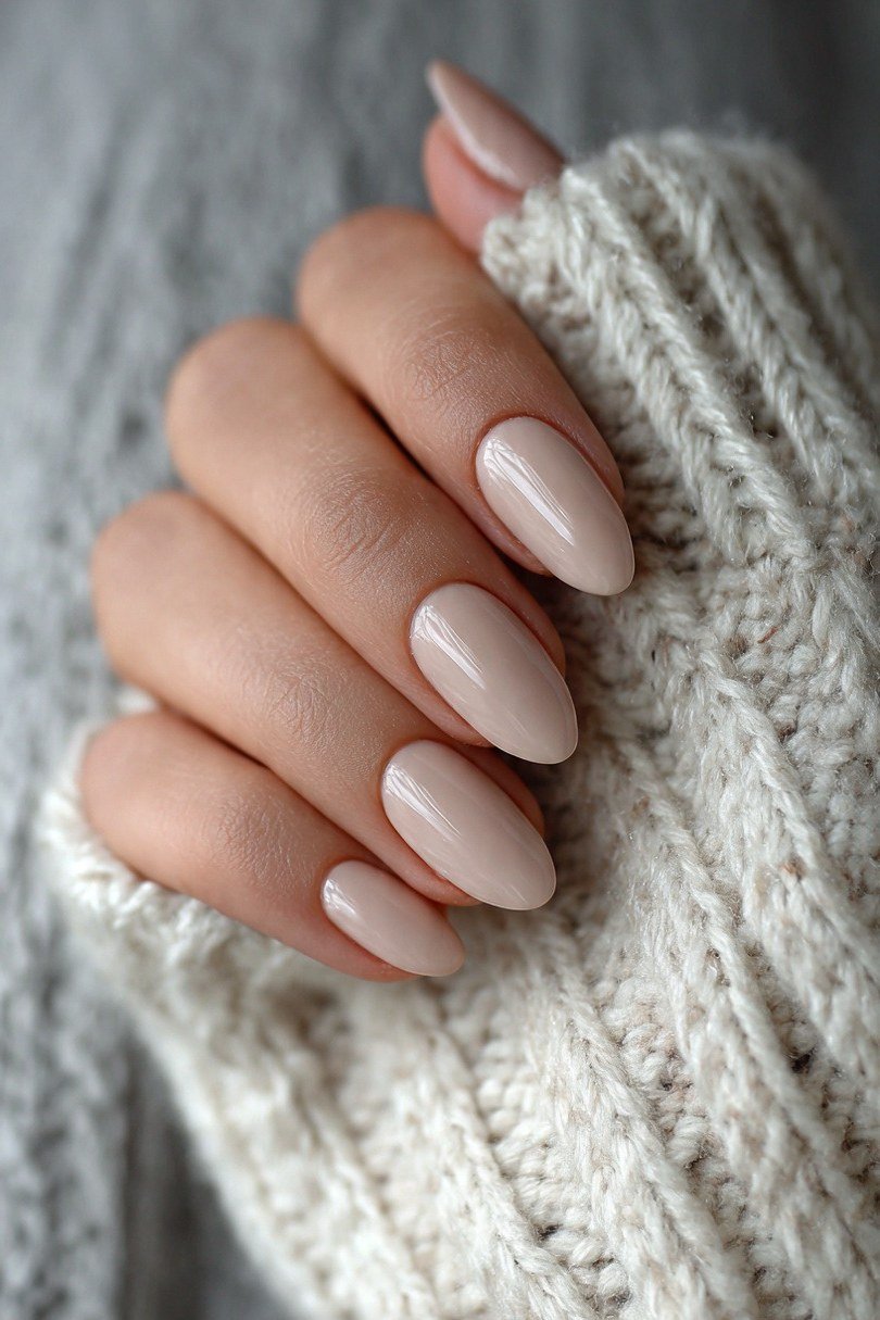 short almond, glossy nude, hand tucked in cream knit sleeve , for women over 60