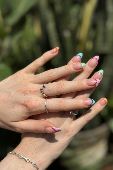 Rainbow french tip gel nails for mature hands