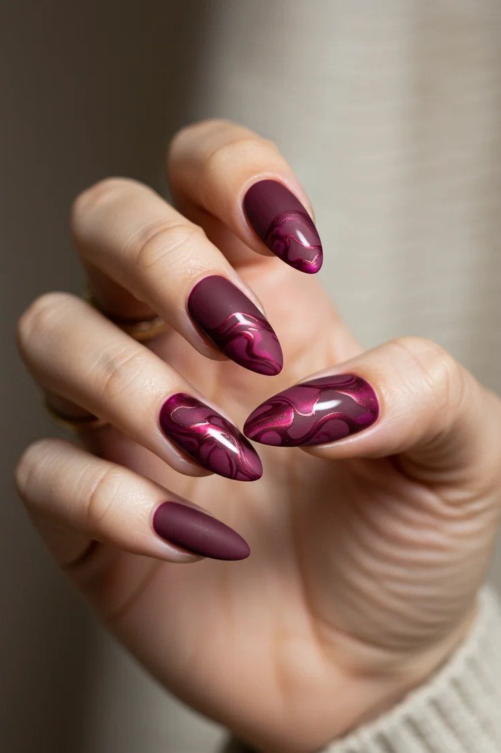 Burgundy plum marble oval nails for women over 50