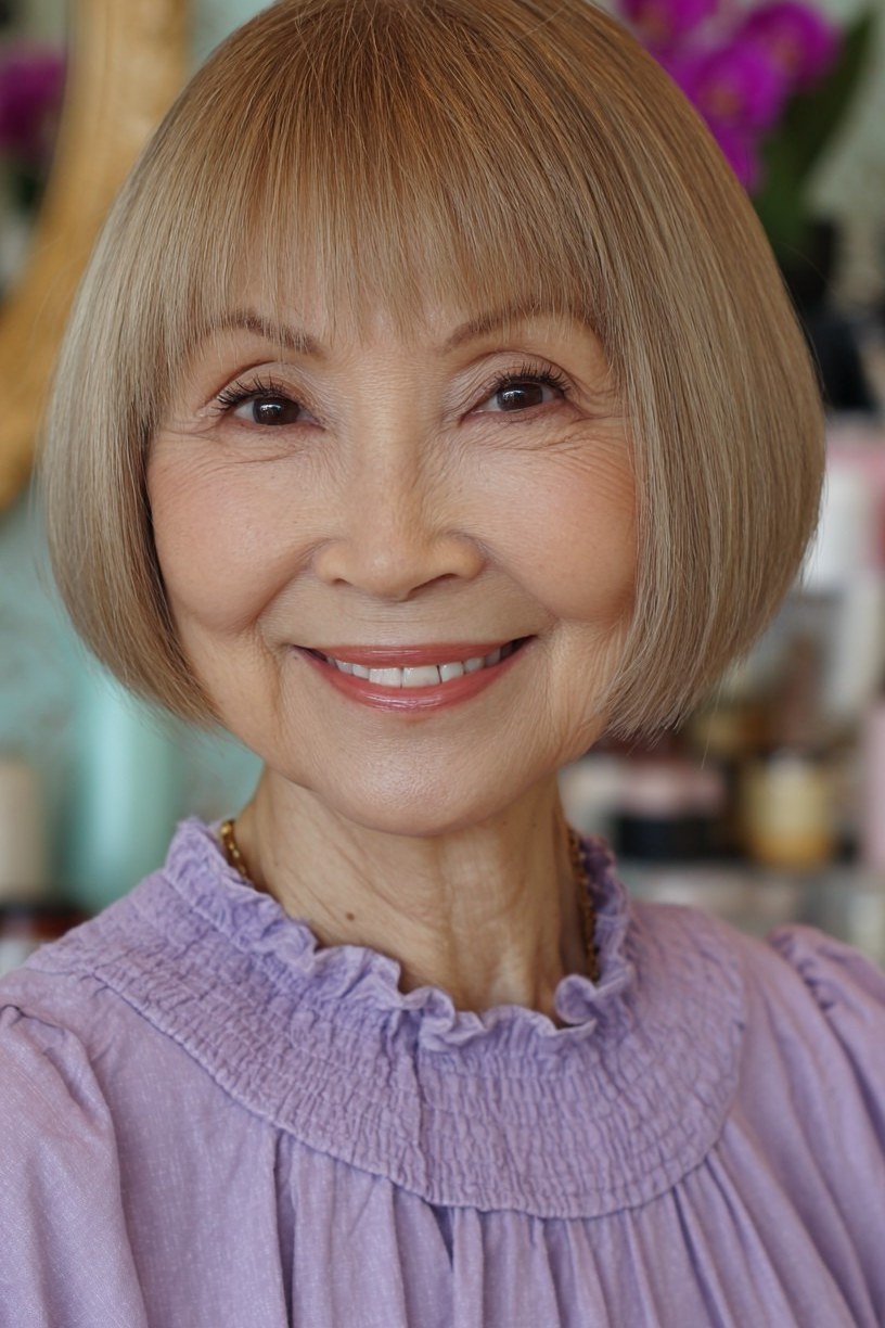 Black bob haircut for women over 70 with bangs, side view