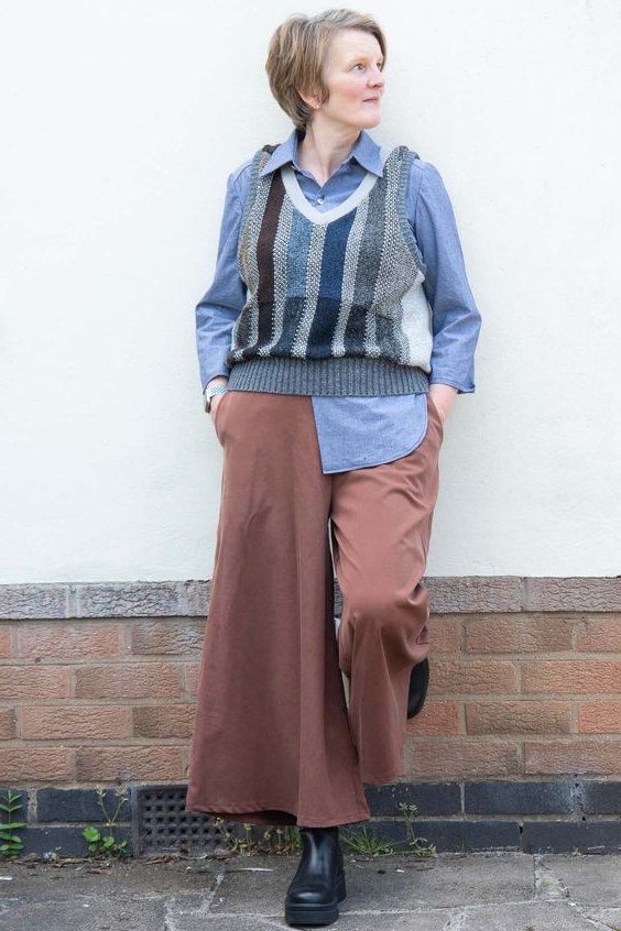 striped sweater vest and rust trousers fall outfit for women over 60
