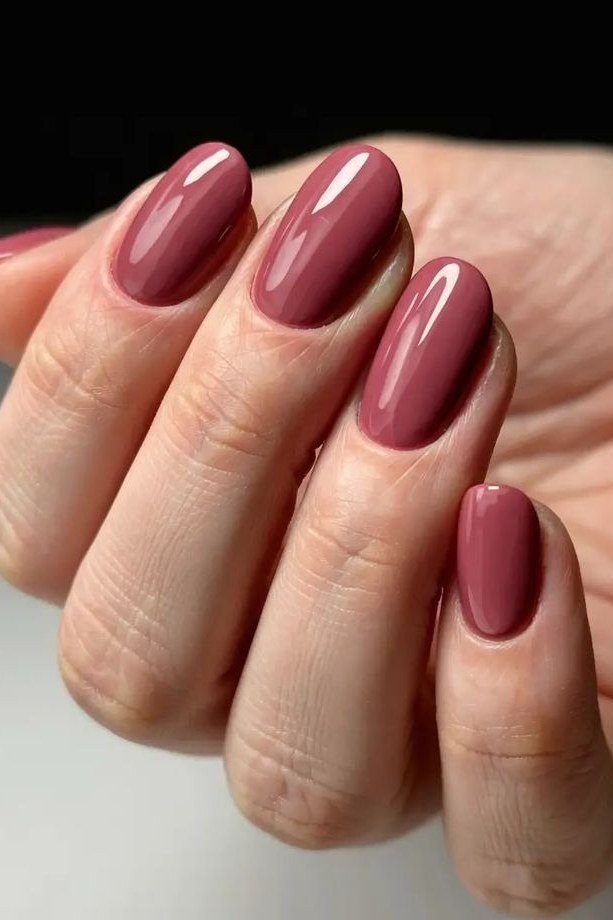 dusty mauve glossy almond nails