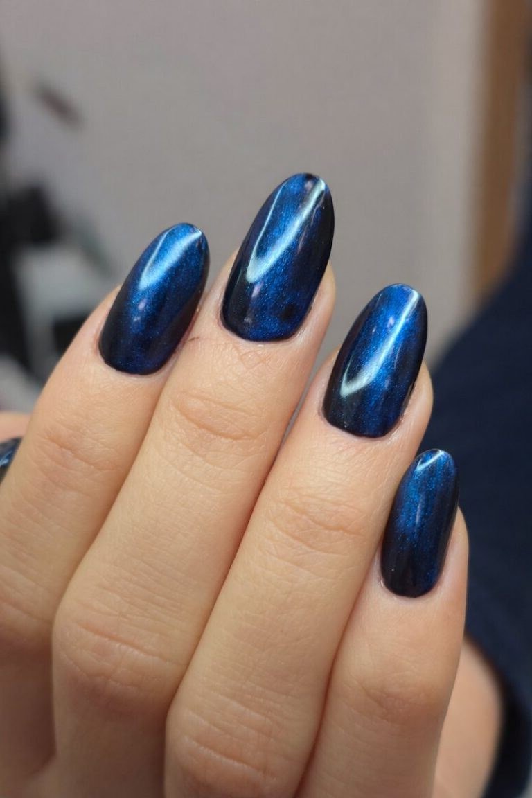 Cobalt Blue Cat Eye Nails - Vivid cobalt blue with strong magnetic shimmer covers these medium length almond nails.