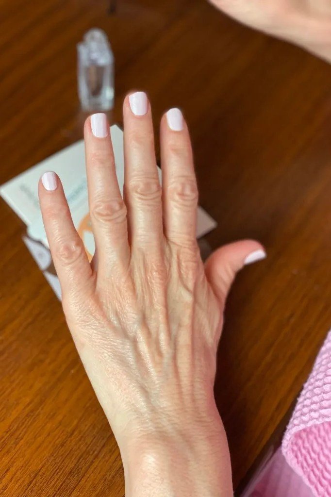 white tip short nails on aged hands