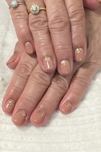 French tips with gold glitter, mature hands - classy nail design for older women