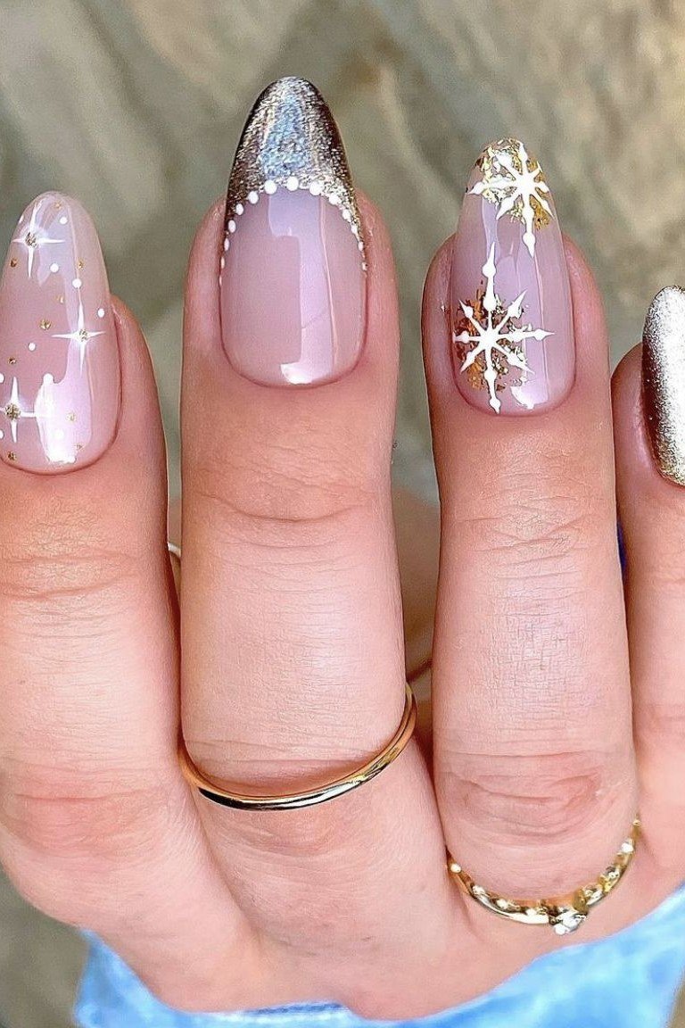 Nude with white snowflake art and silver glitter tips - Christmas nail design for older women