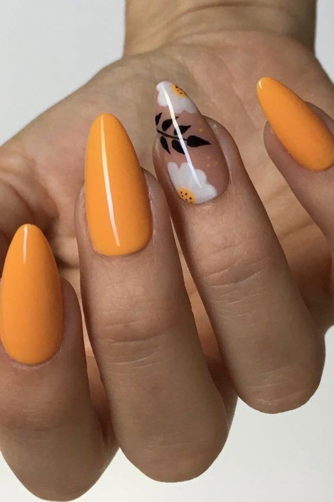 Mustard yellow nails with art accent, fall nail design for older women