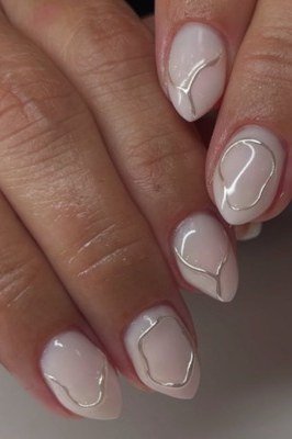 Milky nails with white swirl art, sophisticated nail design for women over 50