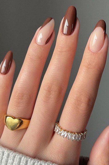 Chocolate brown French tip gel nails on nude almond base, fall French manicure