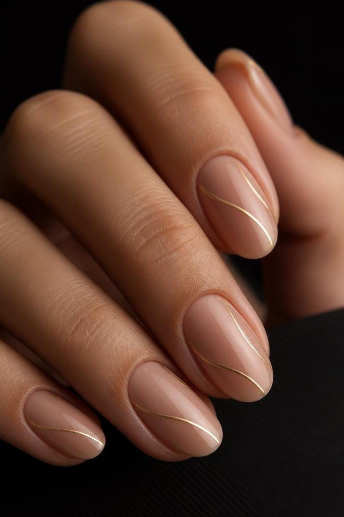 Nude Almond with Gold Line Dark Background - elegant nude nail design for women over 60