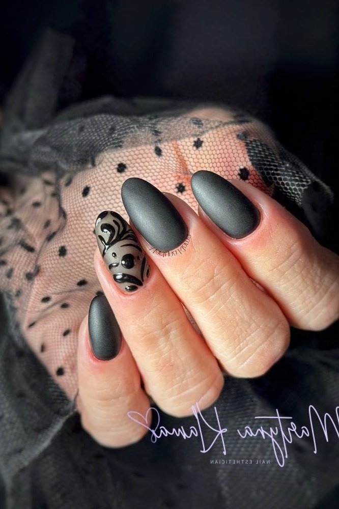 Nail art design for women over 60: black nails with black lace art