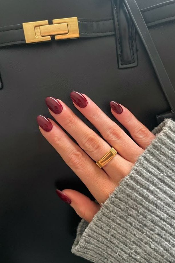 Burgundy Nails with a Dark Handbag, fall nail color idea for women over 50