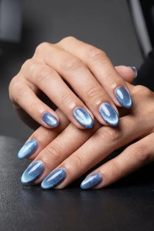 Frosty Blue Cat Eye Nails - Pale frosty blue with icy magnetic shimmer covers these short to medium oval nails.