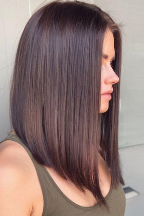 Straight brown lob haircut on an older woman, side profile, medium hairstyle for women over 60