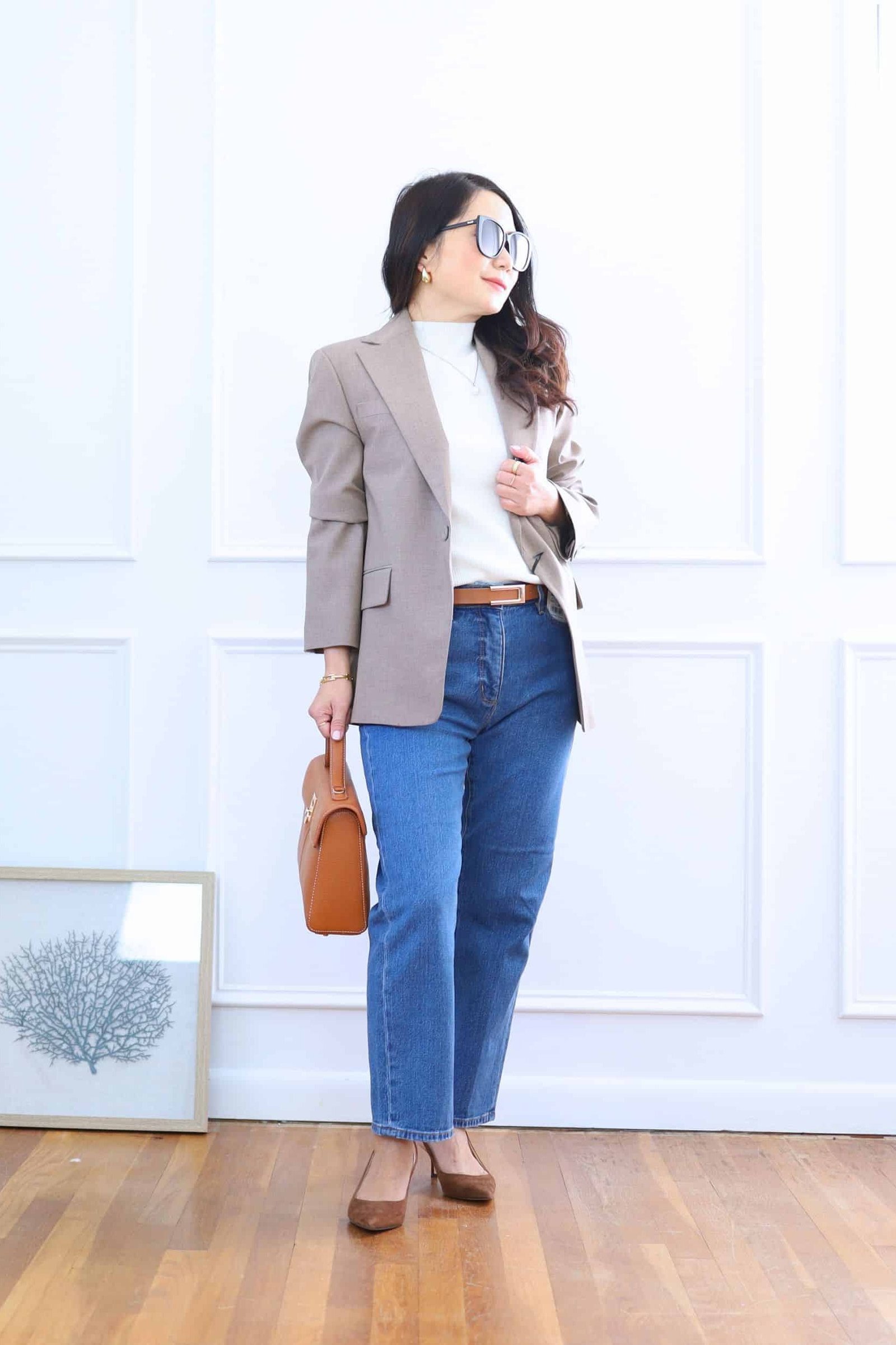 Work outfit for women over 40: taupe blazer with blue jeans