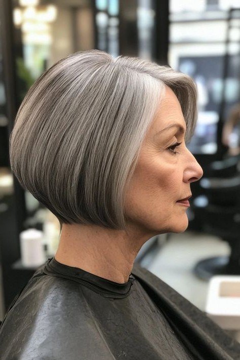 Sleek rounded silver-grey french bob in side profile