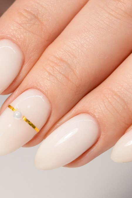 White nails with thin gold line accent nail art