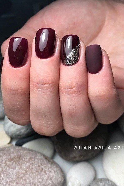 Short dark burgundy nails with glitter accent nail for women over 50