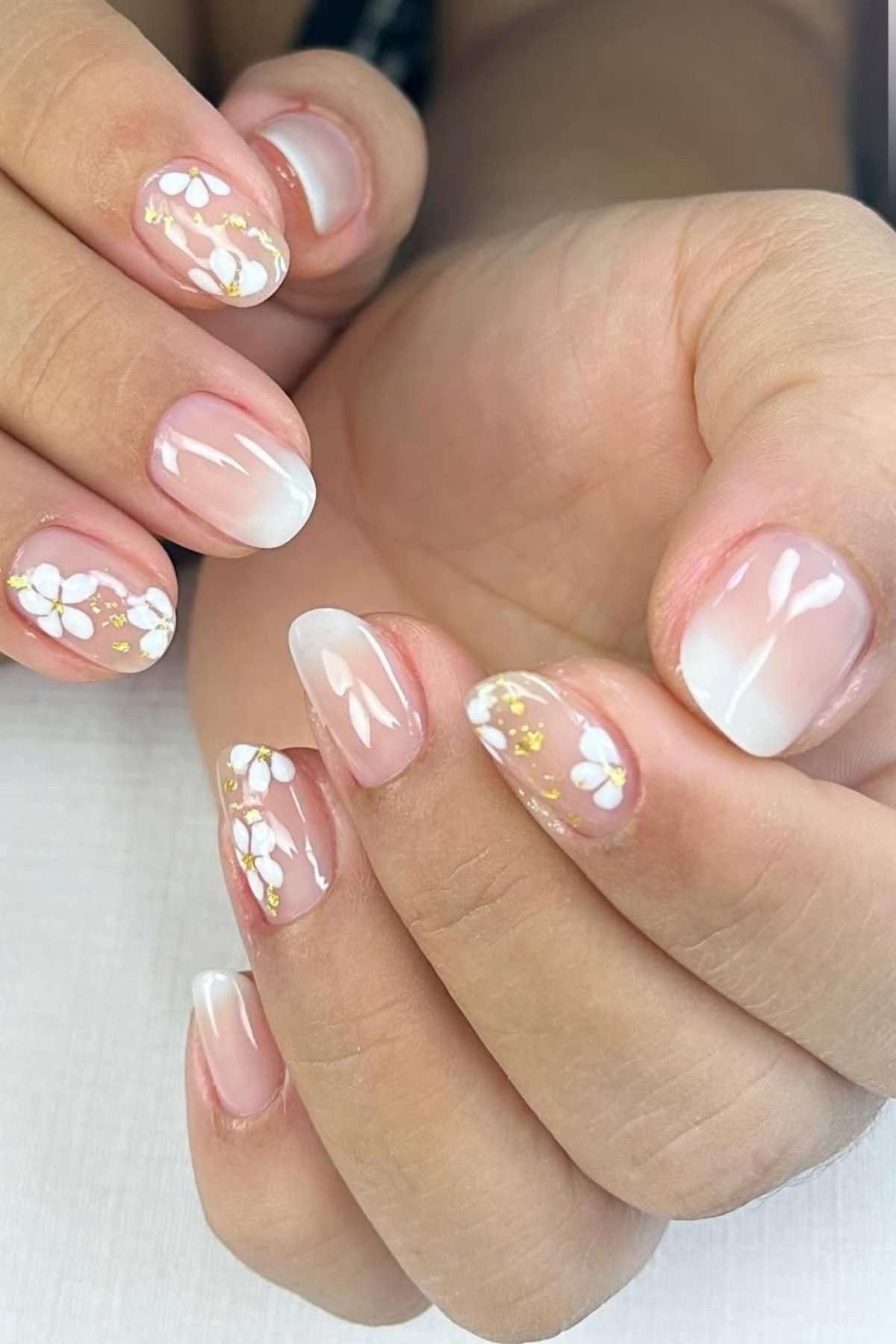 White with Gold Foil Flakes on Short Almond - short nail design for women over 40