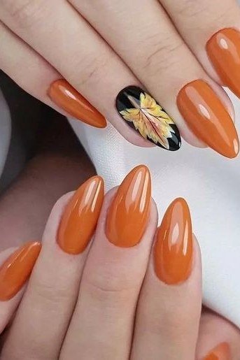 Burnt orange with sunflower art almond, elegant fall nail design for women over 40