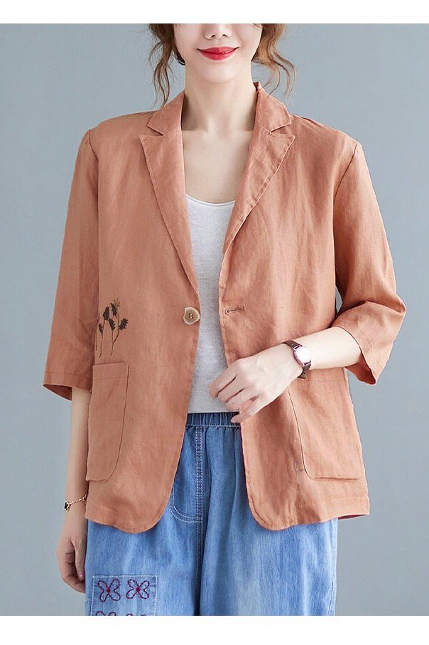 Terracotta linen blazer with white top and blue linen pants, studio for women over 60