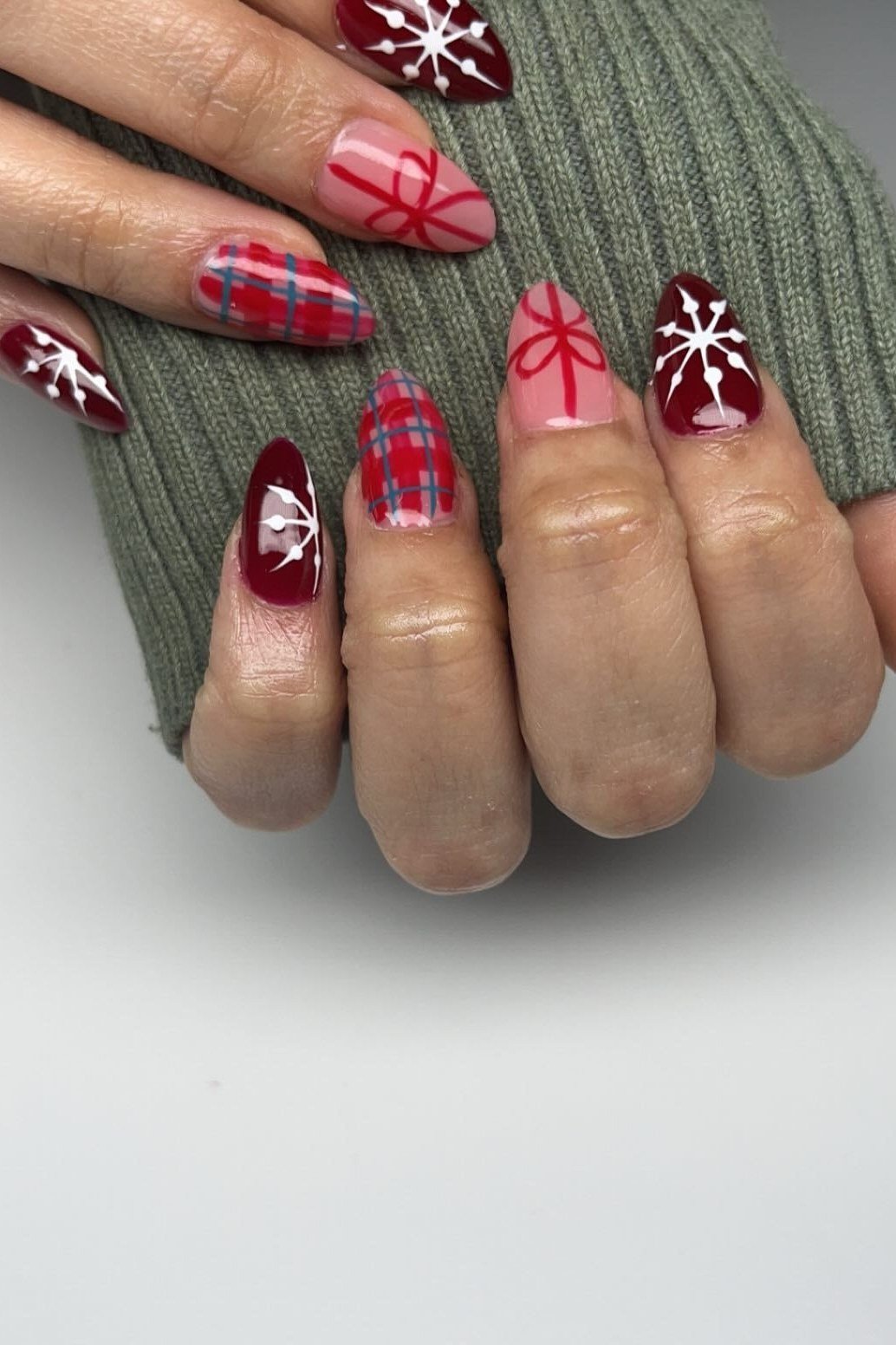 Red Plaid and Snowflake Nail Mix, fun winter nail idea for women over 60