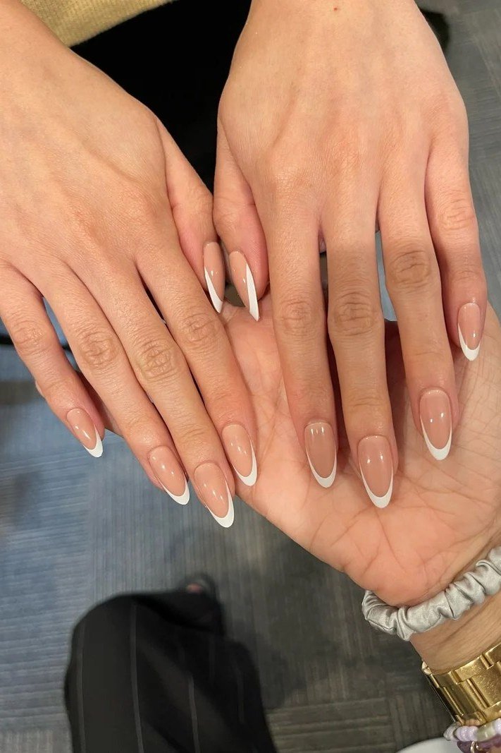 Short French manicure on mature hands