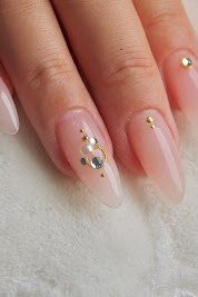 Nude french with subtle gem accents