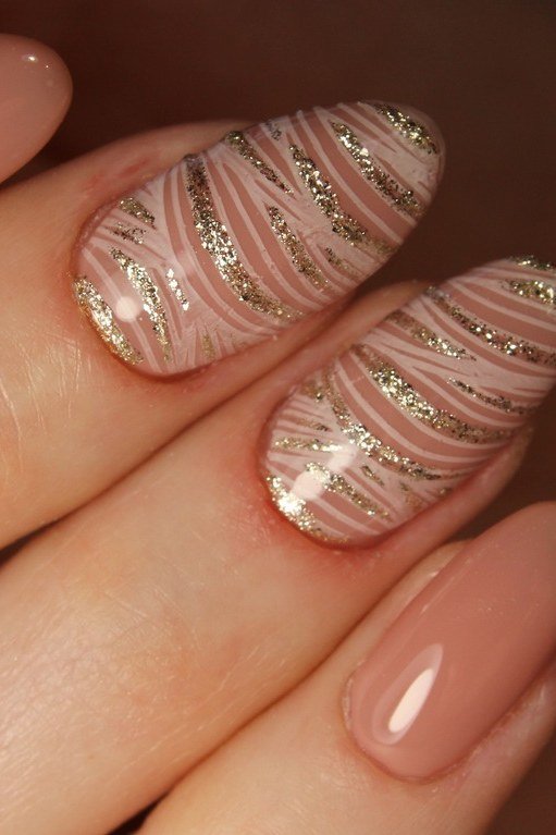 nude with rose-gold marble accent nail - winter nail trend for older women